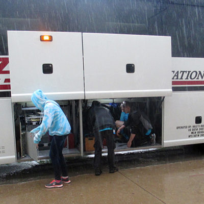 Loading the pit into the coach bus on Saturday in the pouring rain!